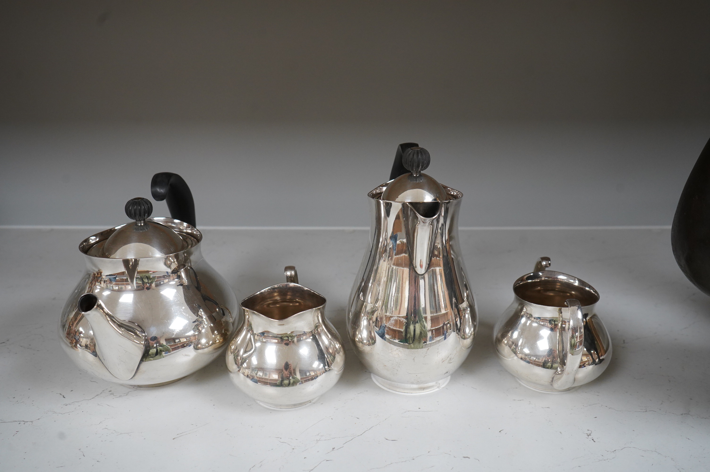 Eric Clements (1925-2019) a four piece plated tea set, c.1960, Embassy plate by M&W England, water jug and cover, 19.5cm high
